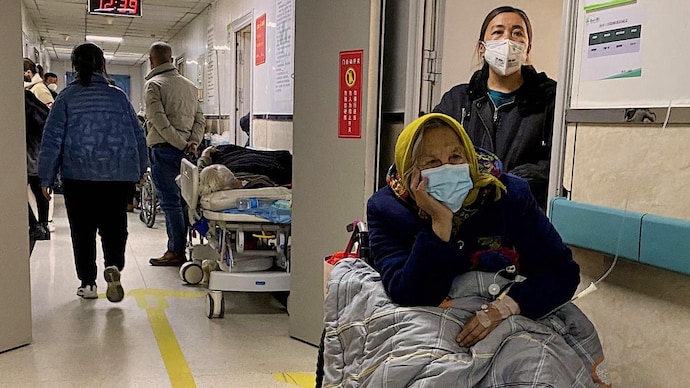 China Covid deaths hit 9,000 per day, says report as more nations impose travel restrictions